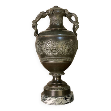 Bronze vase with snakes and a green patina, in the antique style.