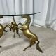 Hollywood Regency style coffee table, 6 patinated brass horses and glass top, 1970.