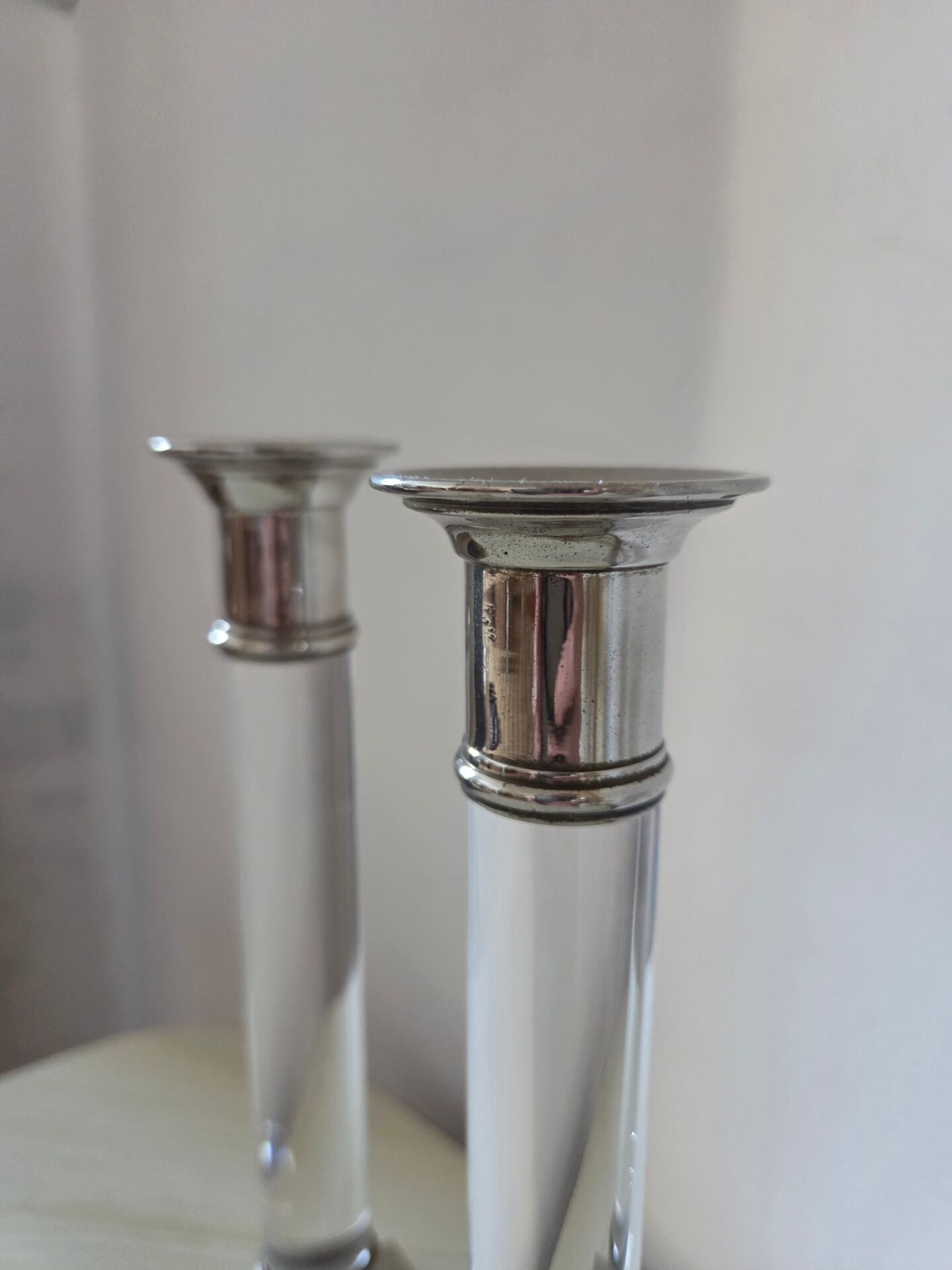 Pair of lucite and silver-plated candlesticks