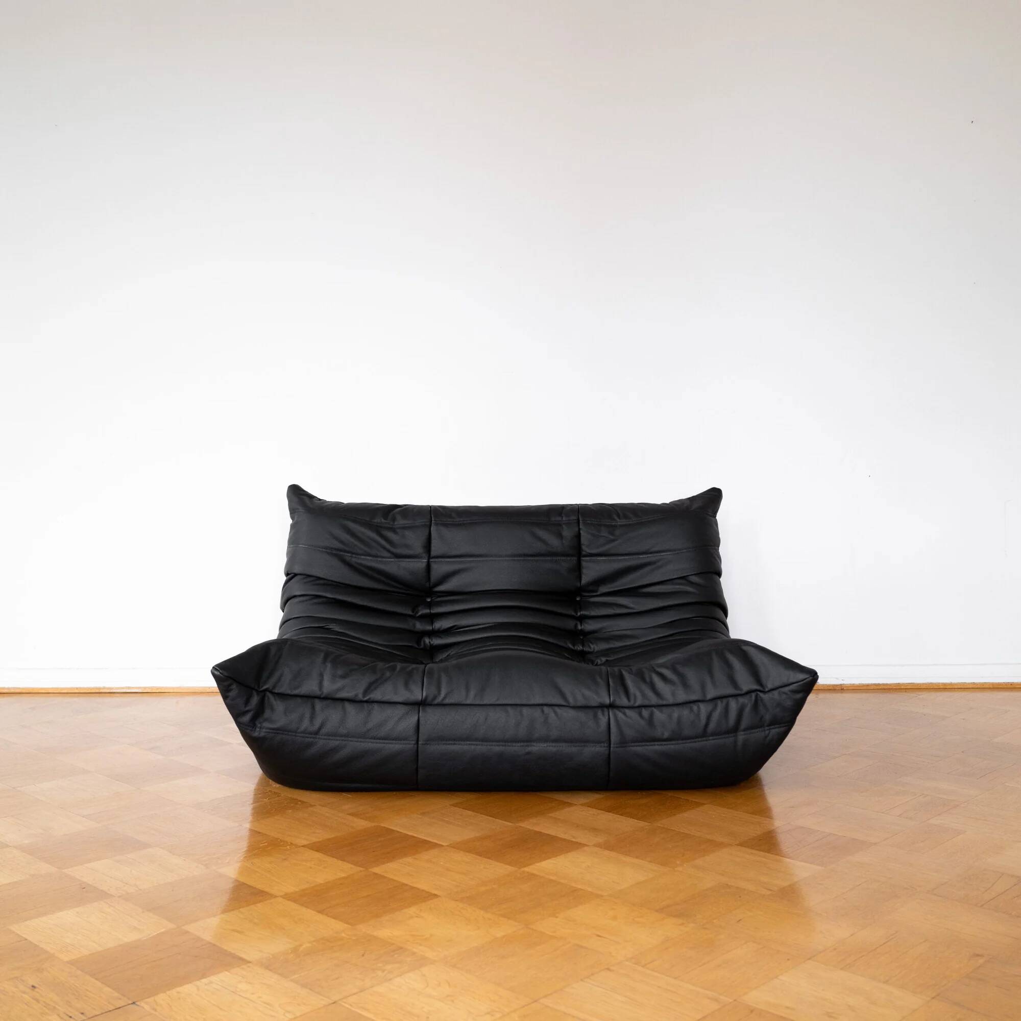 Black leather 2-seater Togo sofa by Michel Ducaroy