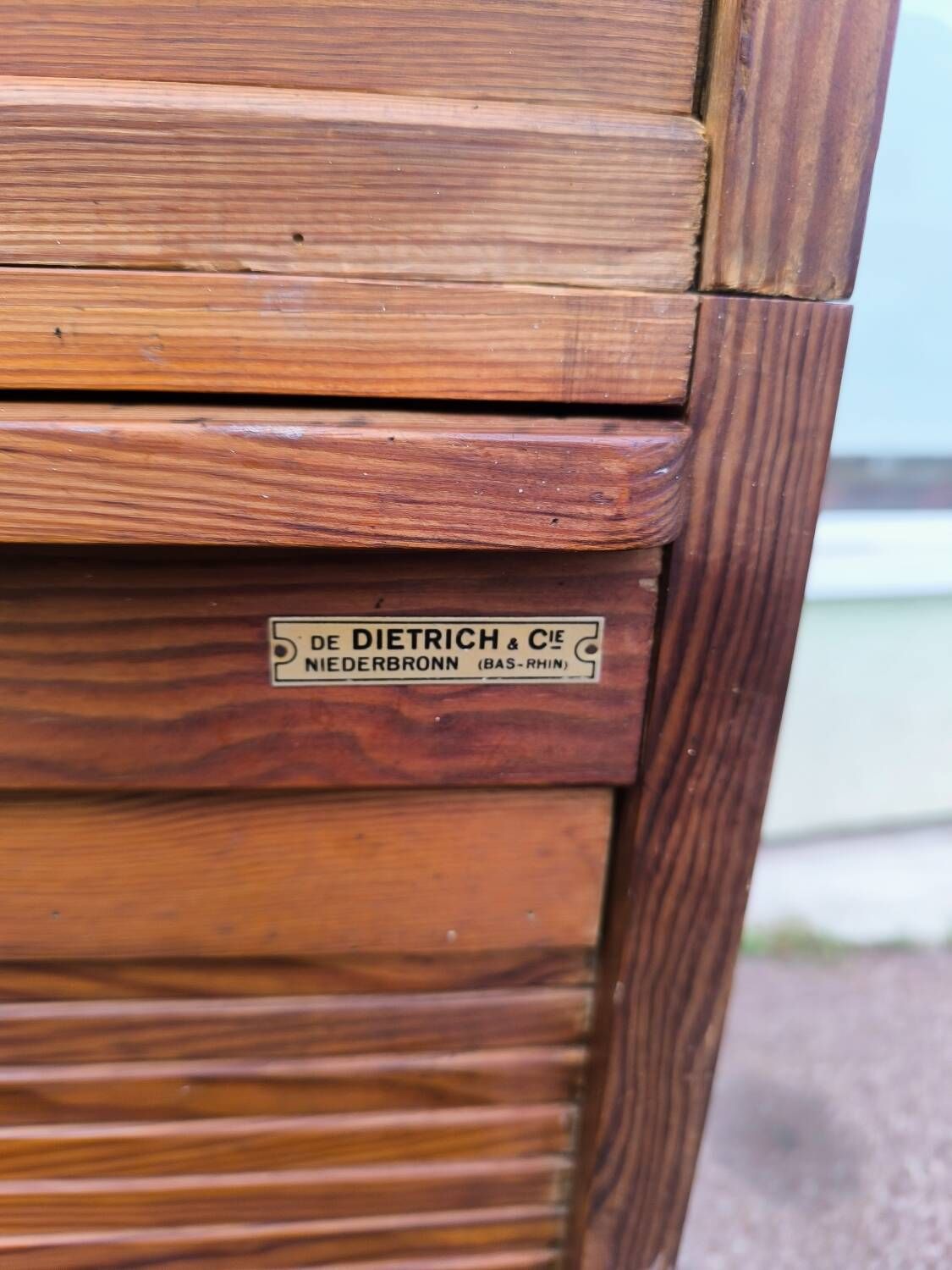 Vintage 1940s secretary desk with wooden curtains, storage, and shutters.
