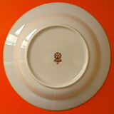 Suite of twelve speckled sandstone soup plates