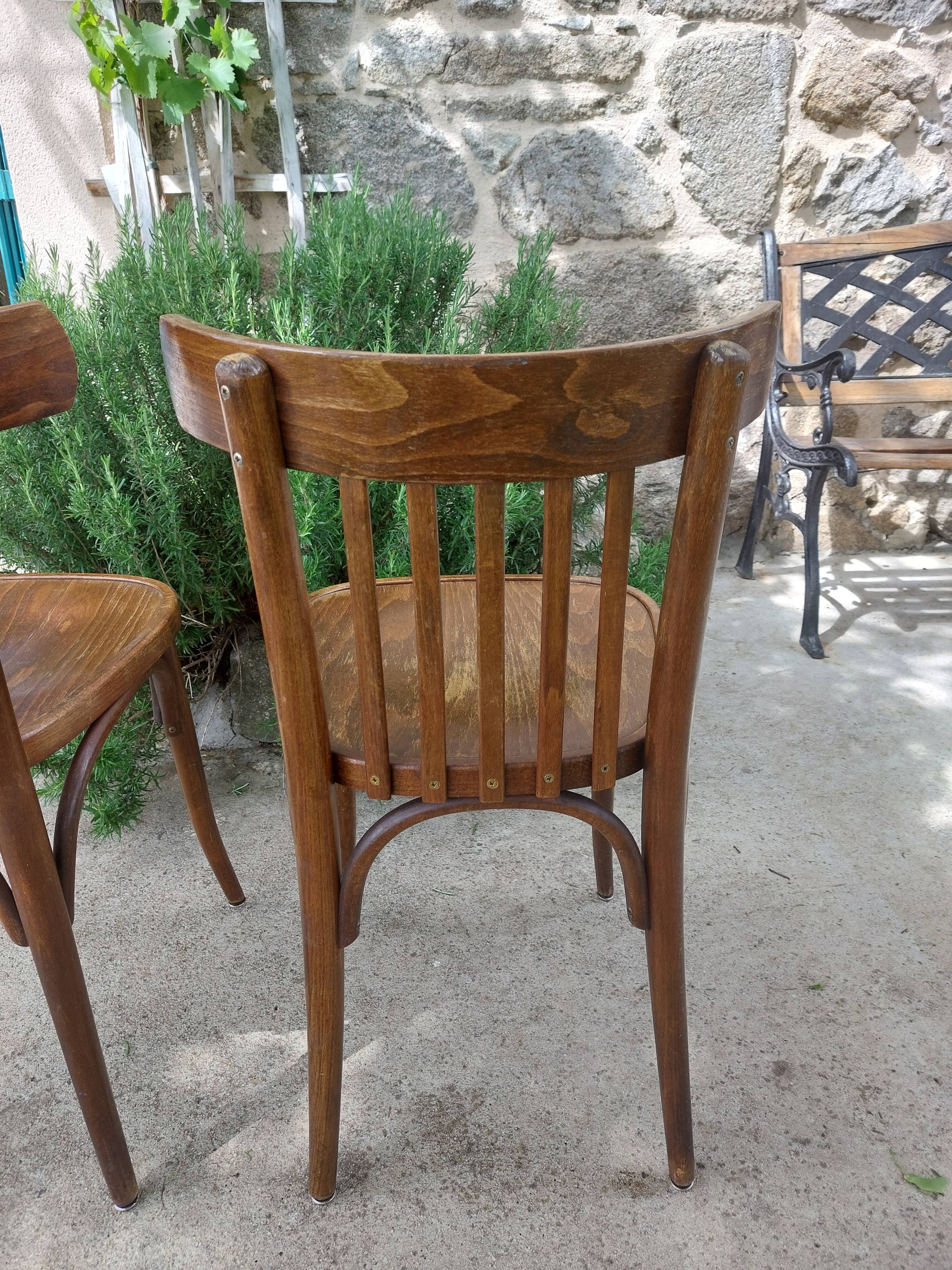 pair of dark bistro chairs, rounded backs, Baumann style
