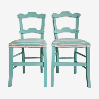 Pair of blue wooden chairs sitting stripes