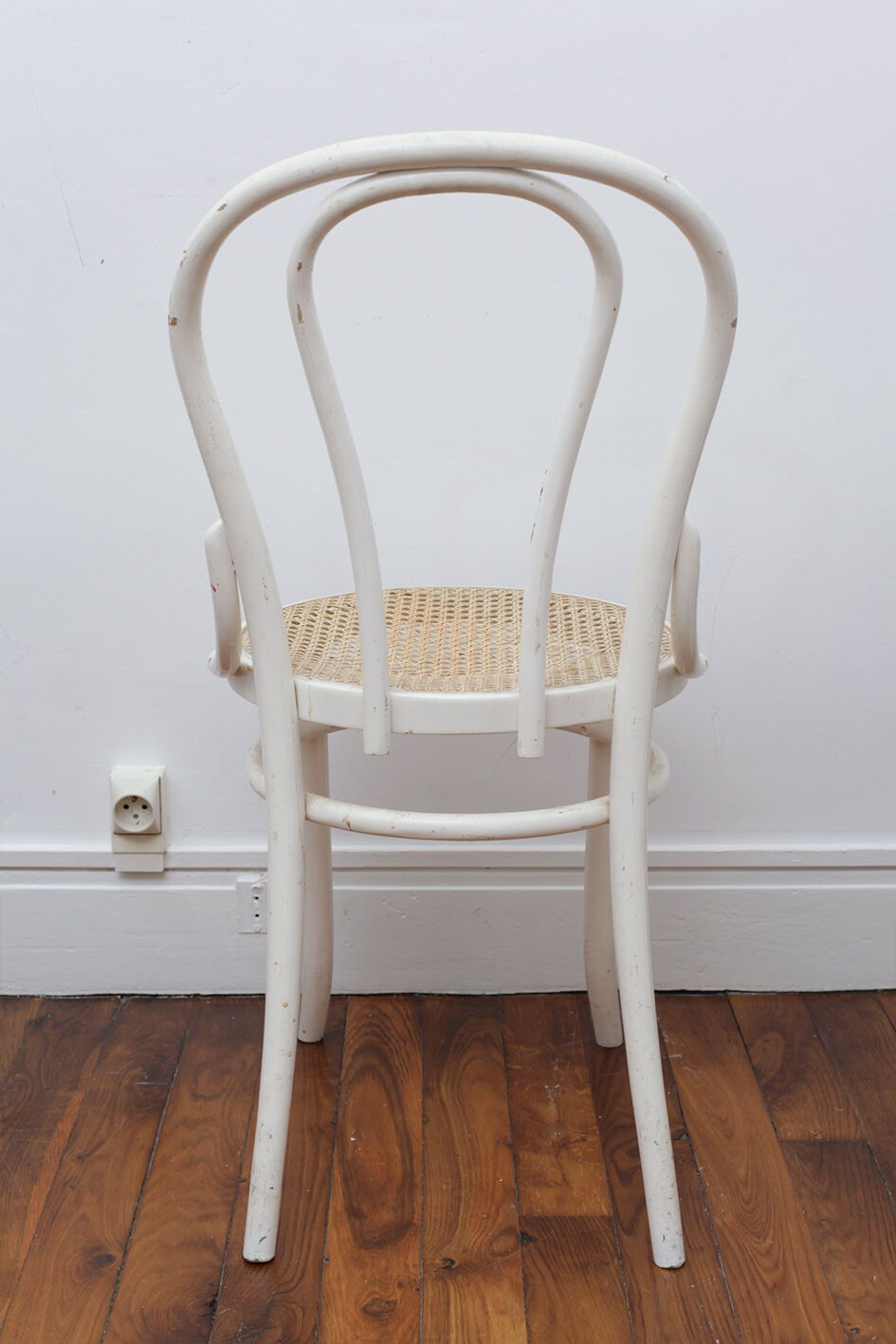 White wooden chair with cannage