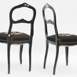 Pair of black Louis XV-style chairs