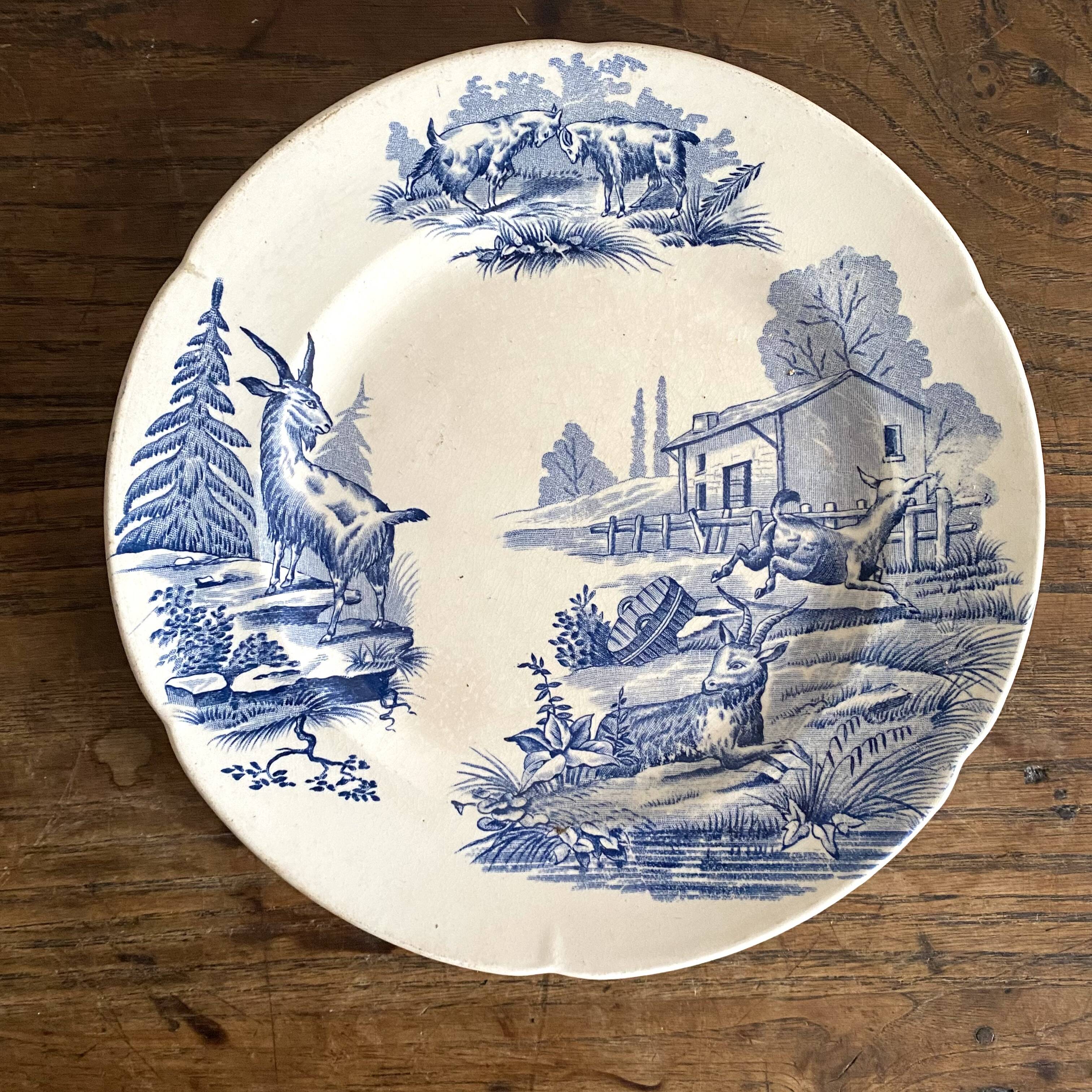 "Rustic" iron earth plate with goats