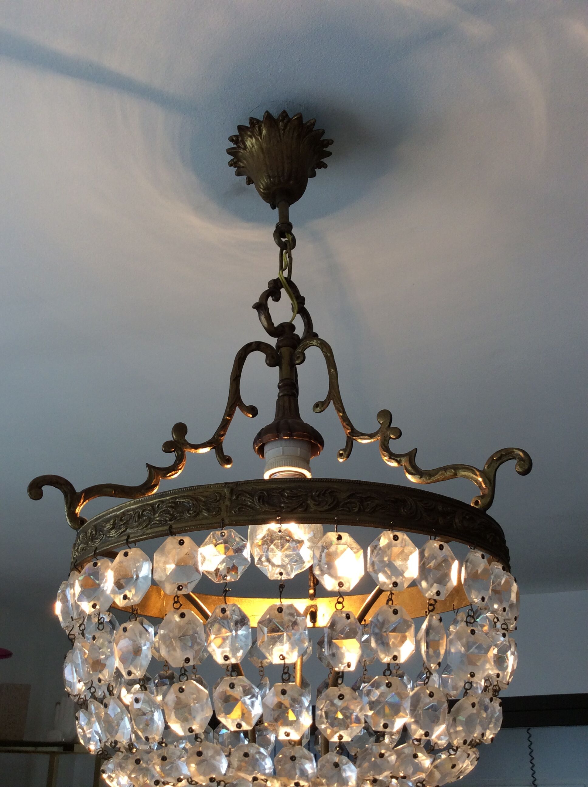 Old chandelier with bronze stamps