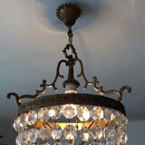 Old chandelier with bronze stamps
