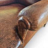 fauteuil club en cuir de mouton anglais ancien avec accoudoirs