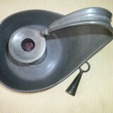 Cellar rat candle holder and its tin extinguisher.