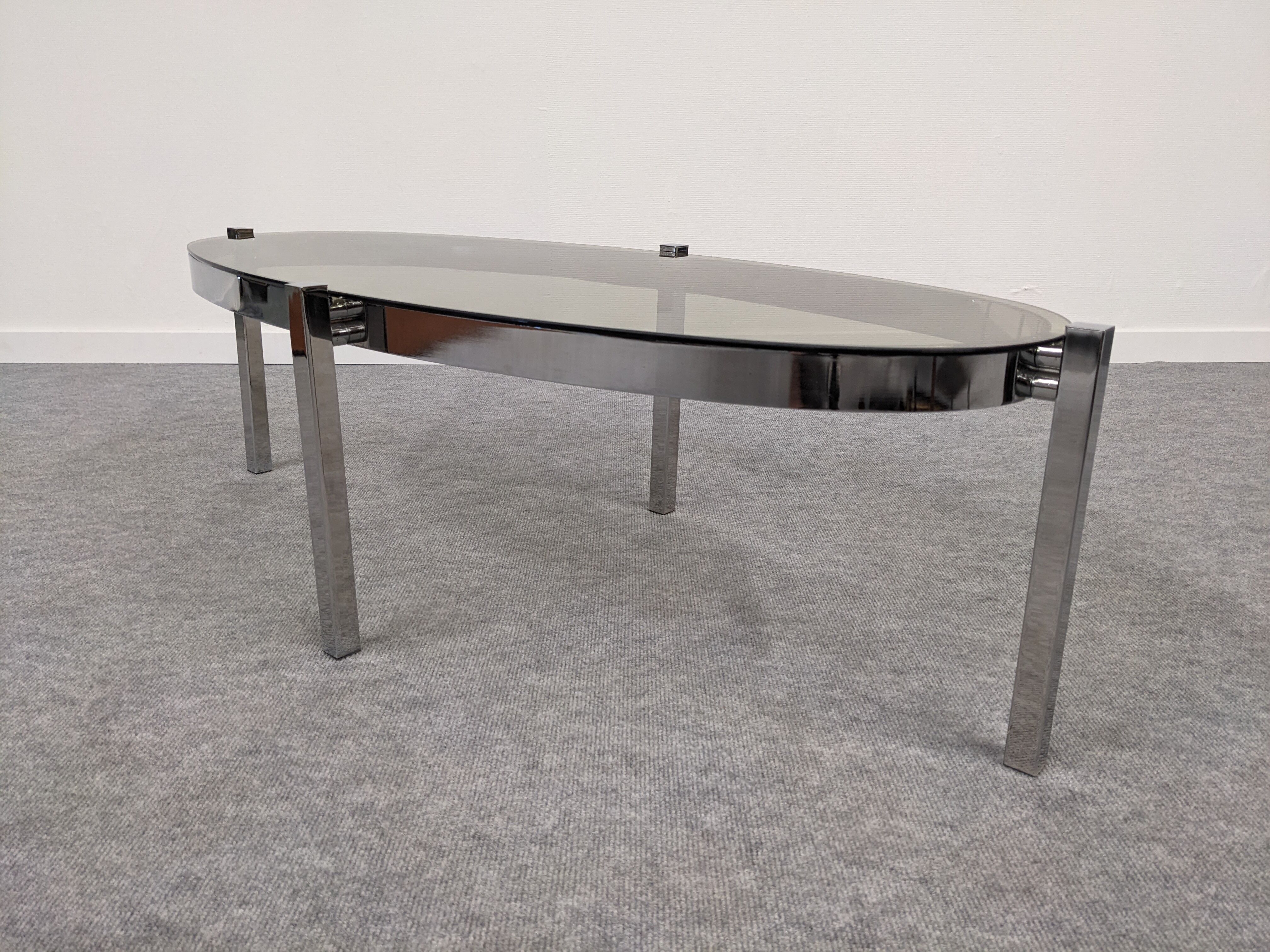 Oval smoked glass coffee table from the 60s/70s