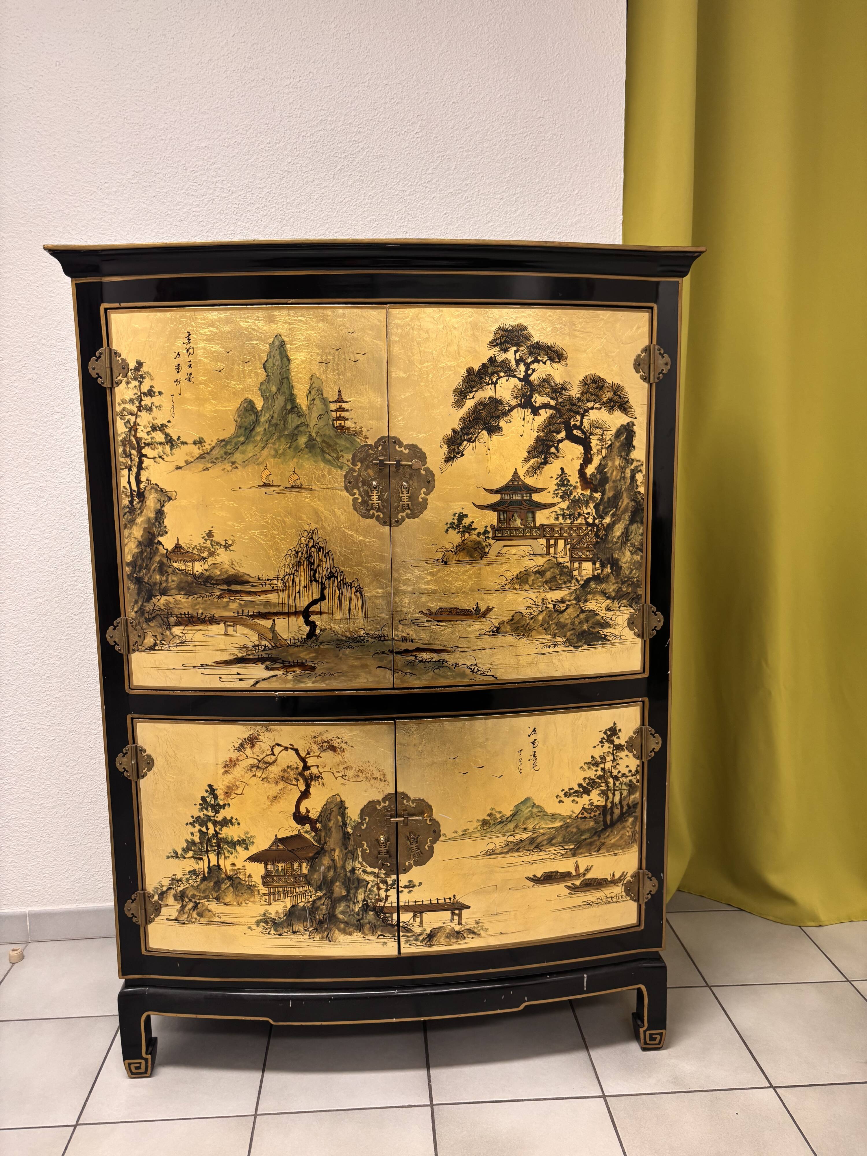 Curved bar cabinet inspired by Chinese design, black lacquer and red interior.