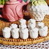 Set of 11 mini rose-shaped porcelain candle holders
