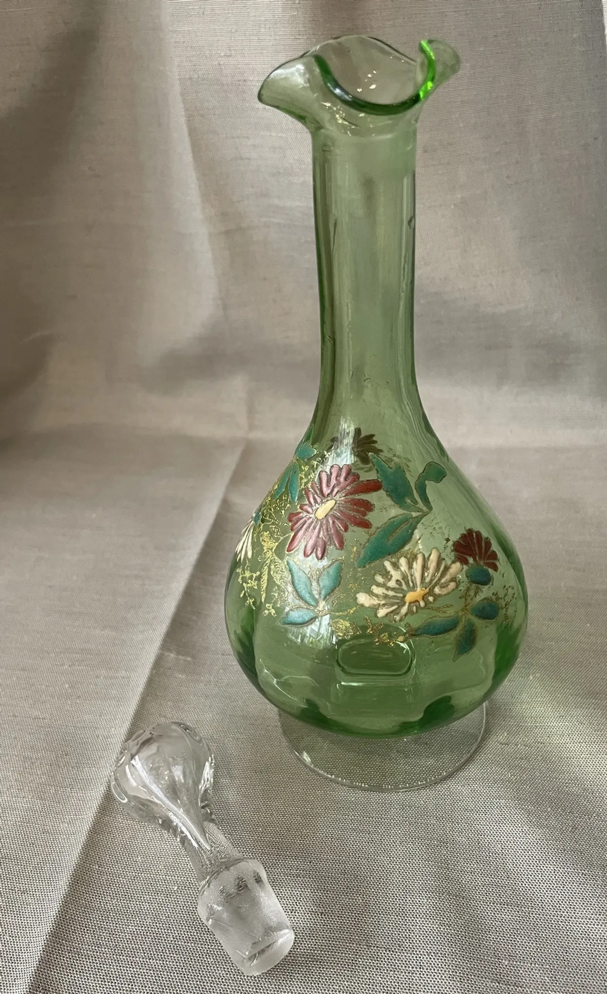 Liqueur carafe in ouraline with floral enamel decoration.
