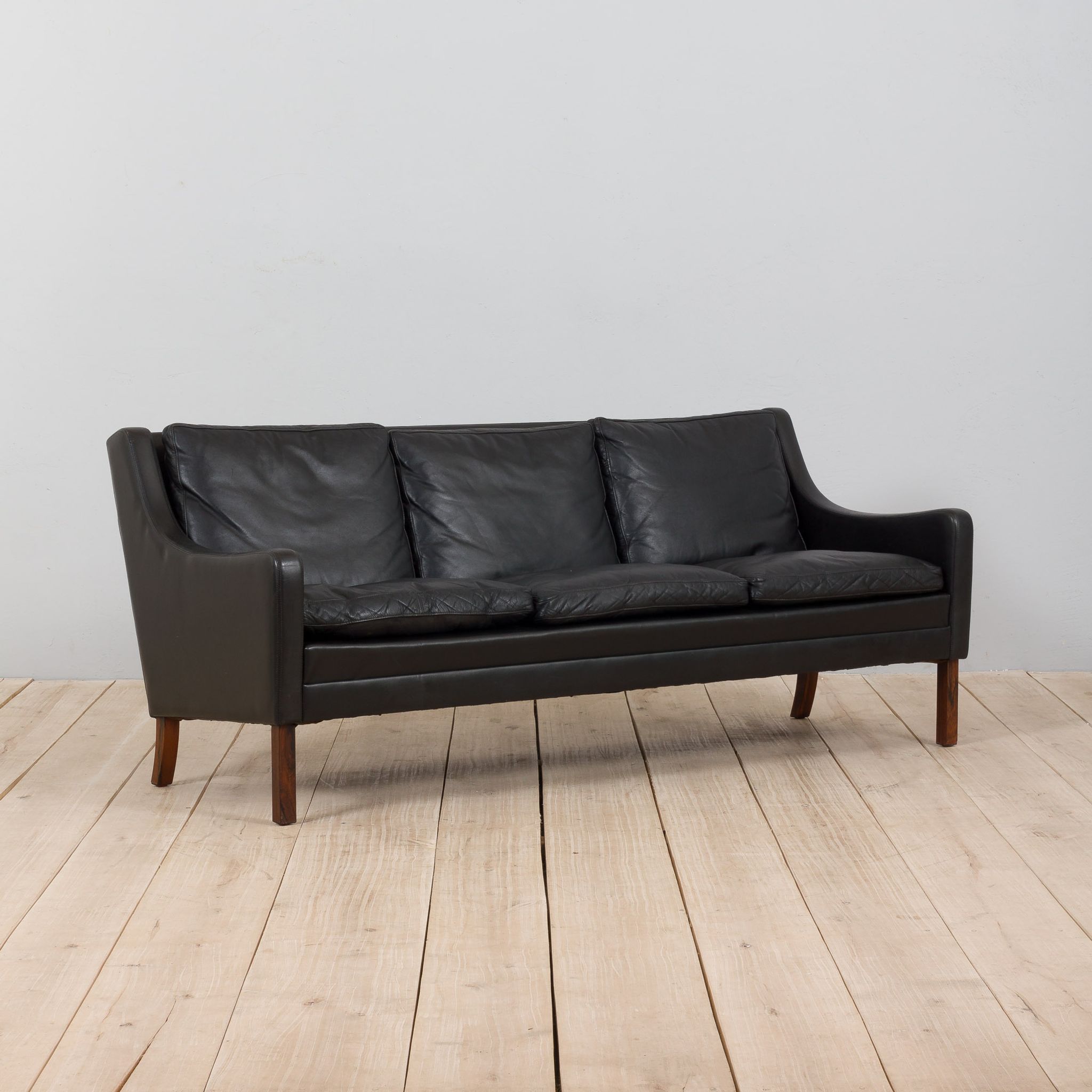 Danish black leather and rosewood sofa