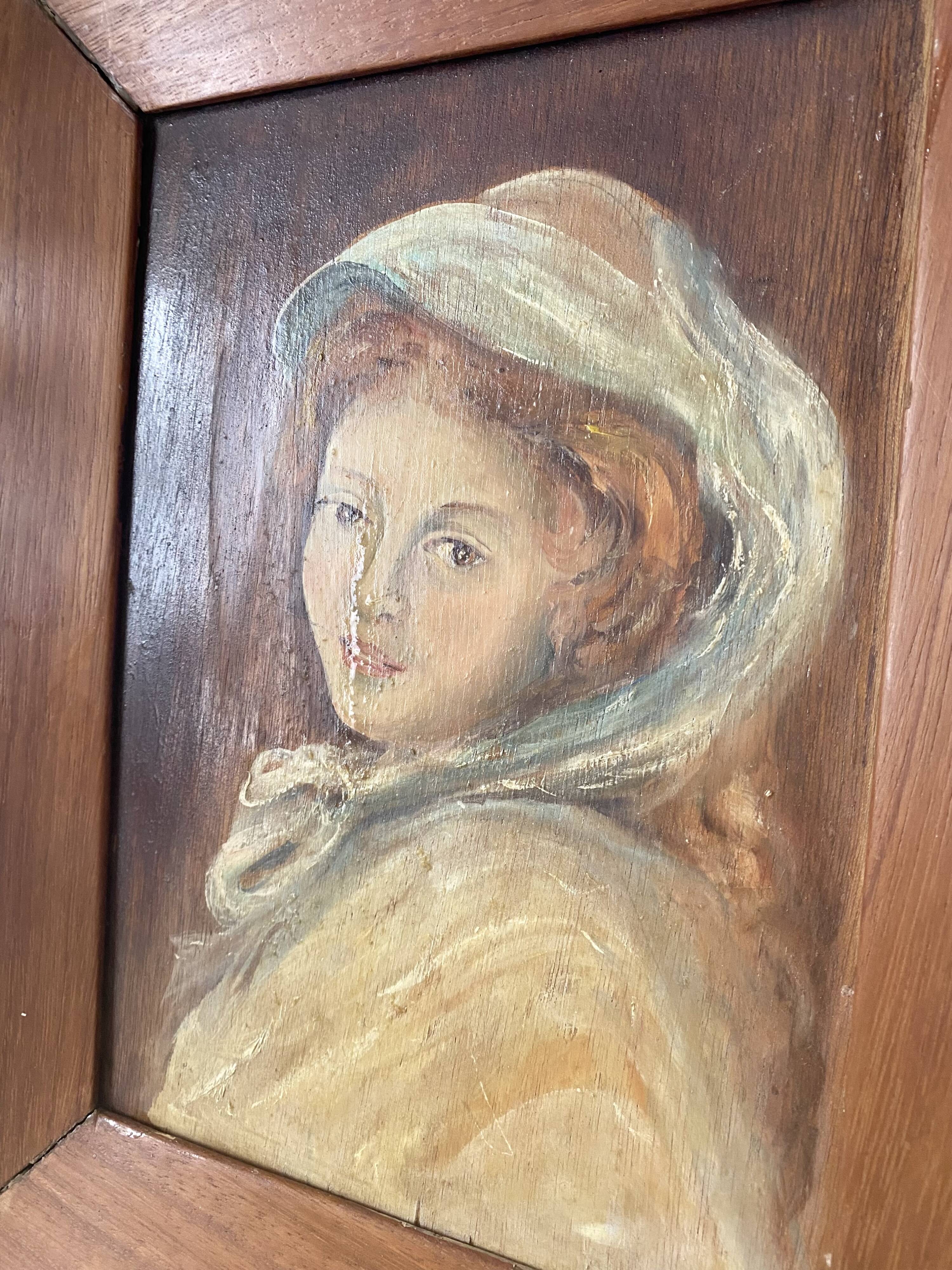Old oil portrait on wood of a young woman