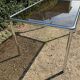 70s dining table in tubular chrome metal and smoked glass