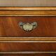 Vintage mahogany buffet with three drawers and shelves.