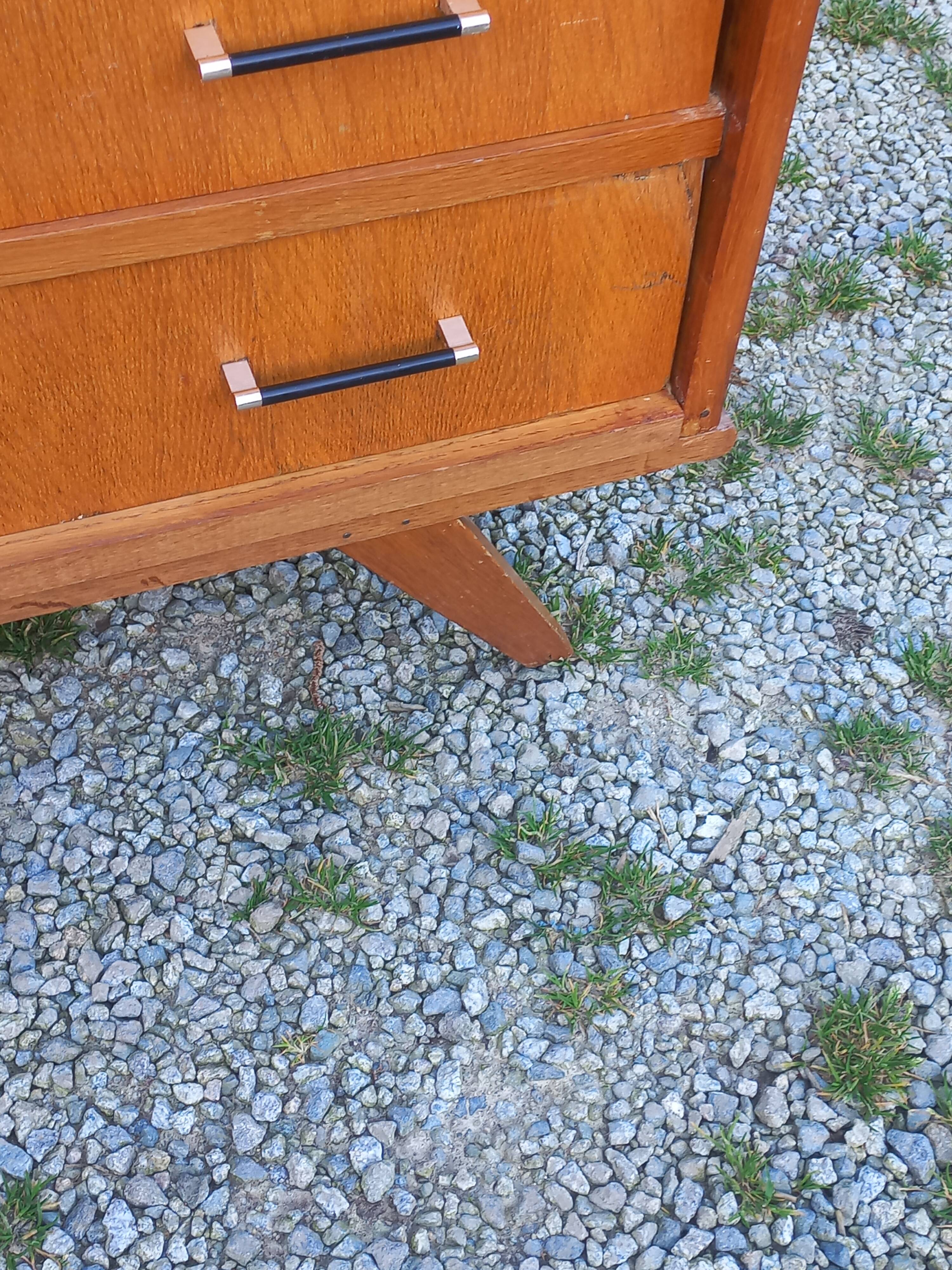 Vintage oak commode with tapered legs and wings from the 1950s.