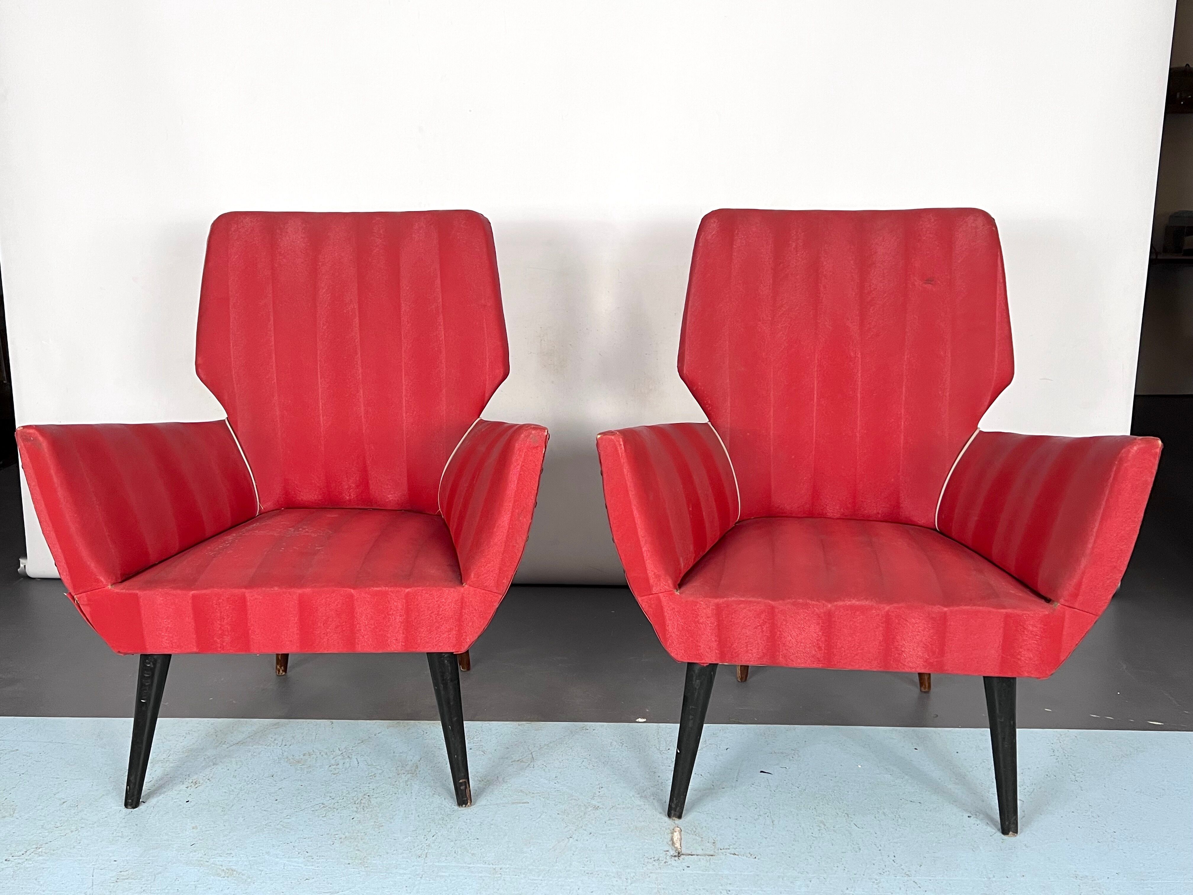 Mid-century modern pair of red armchairs. italy 1950s