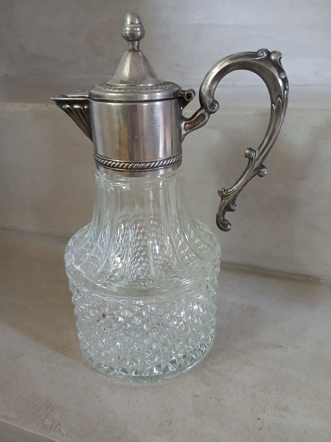 Antique pewter and glass carafe