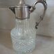 Antique pewter and glass carafe