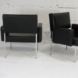 Pair of stainless steel, black leather-like armchairs, France, circa 1970