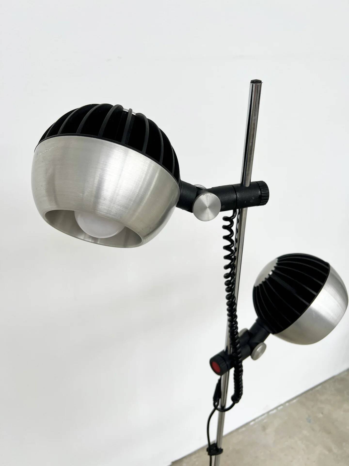 Two-spot floor lamp phase — brushed steel and matte black — 1970s