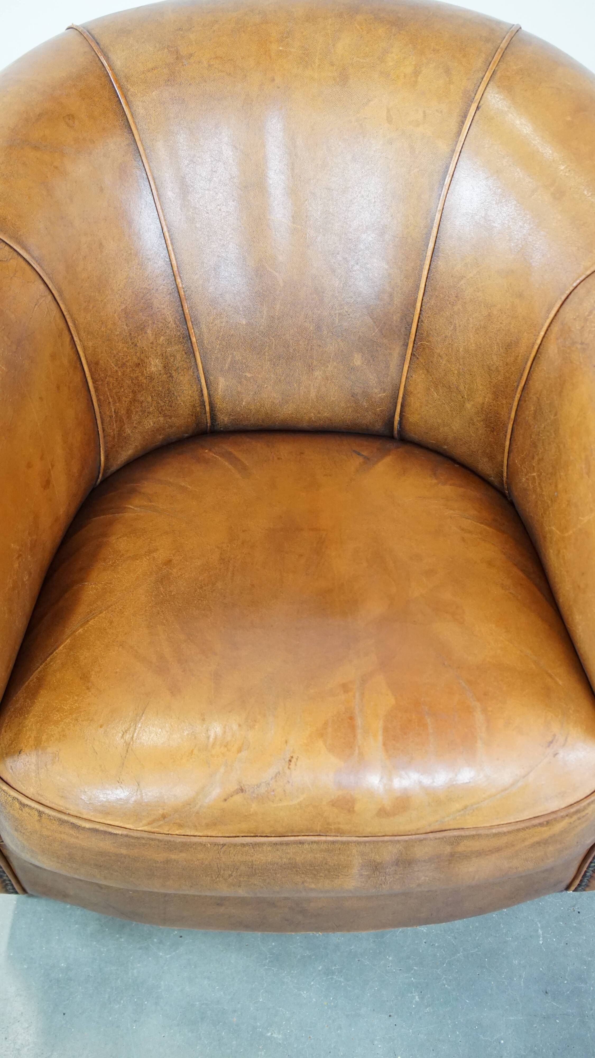 Cognac-colored sheep leather club chair with patina