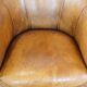 Cognac-colored sheep leather club chair with patina