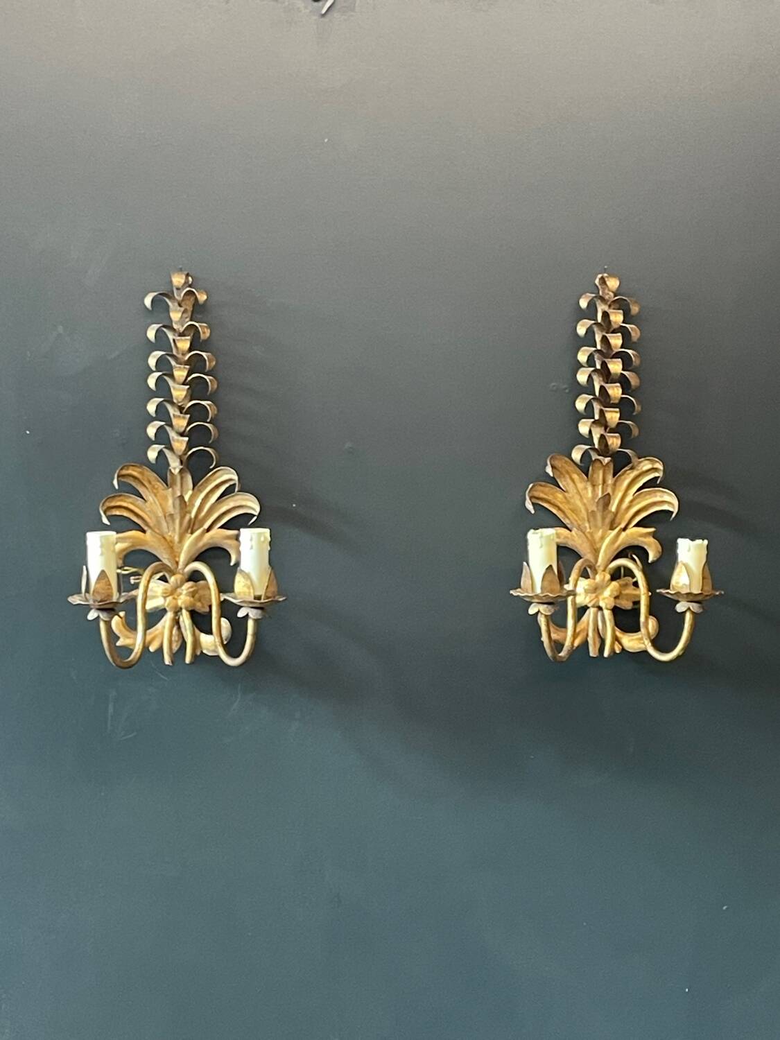 Pair of gold wall sconces
