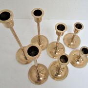 Series of seven candle holders solid brass