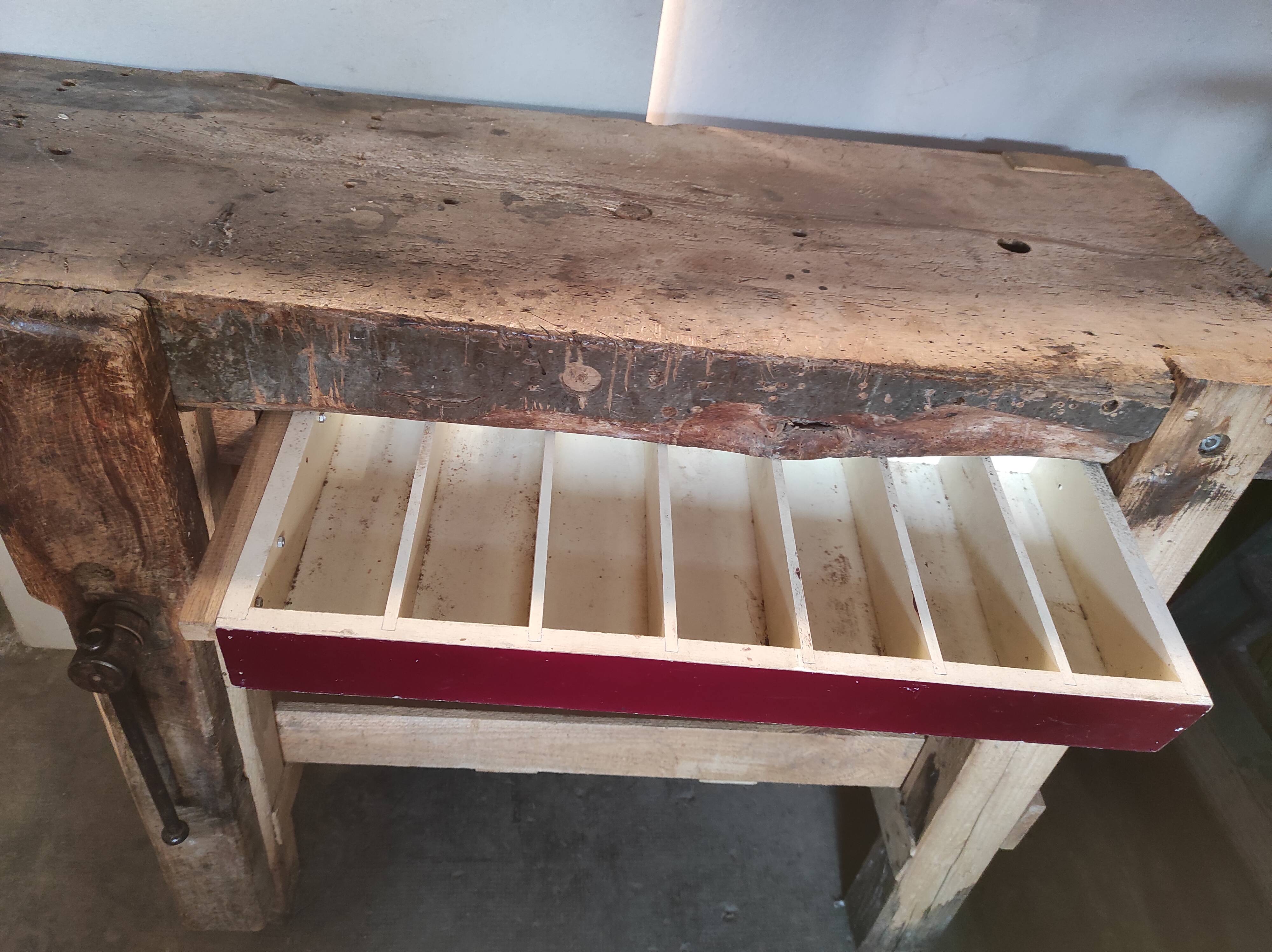 Old homemade vintage solid wood workbench with press and drawer