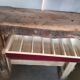 Old homemade vintage solid wood workbench with press and drawer