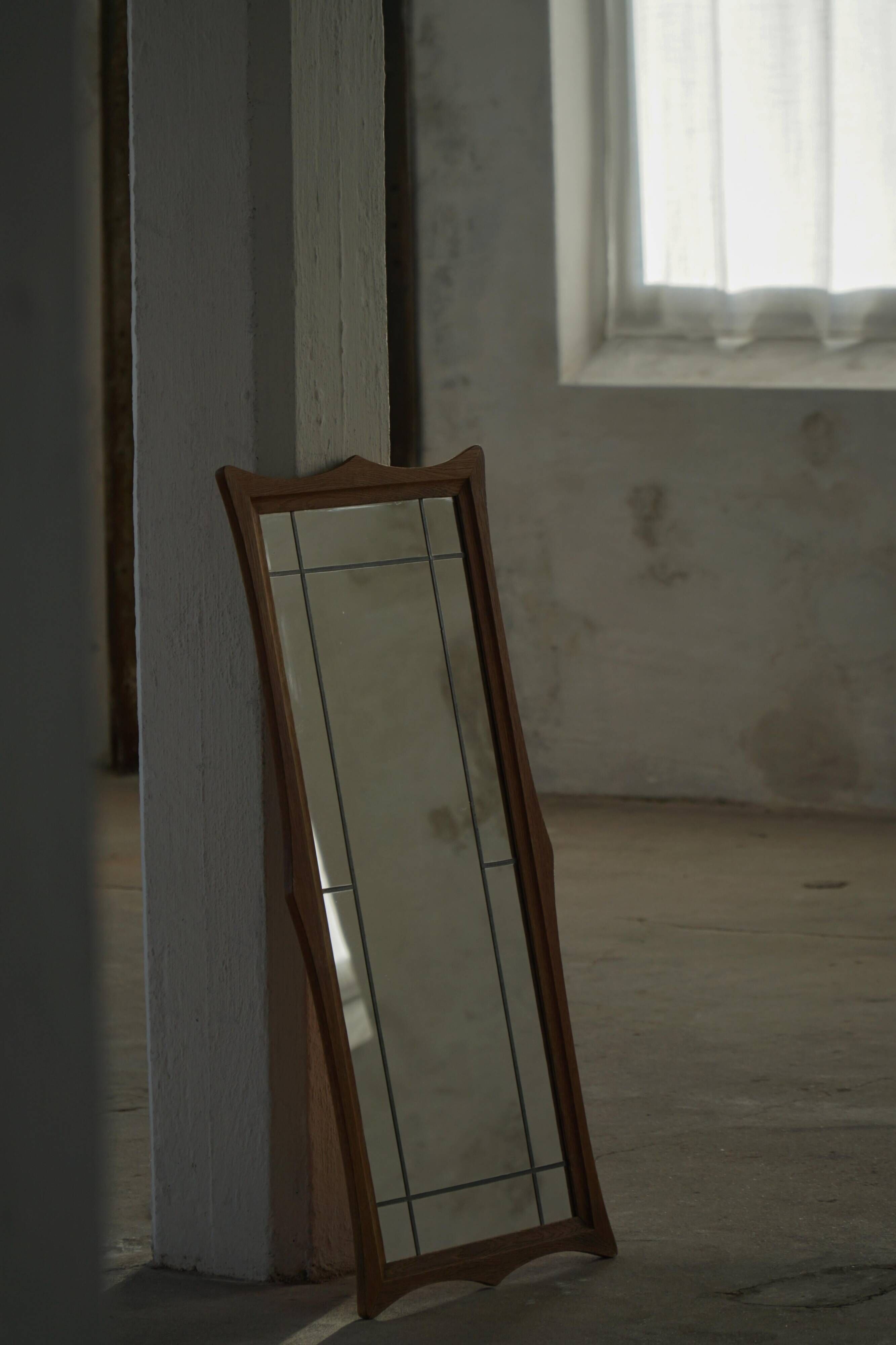Danish wall mirror in solid oak from the mid-20th century, Scandinavian modern design.