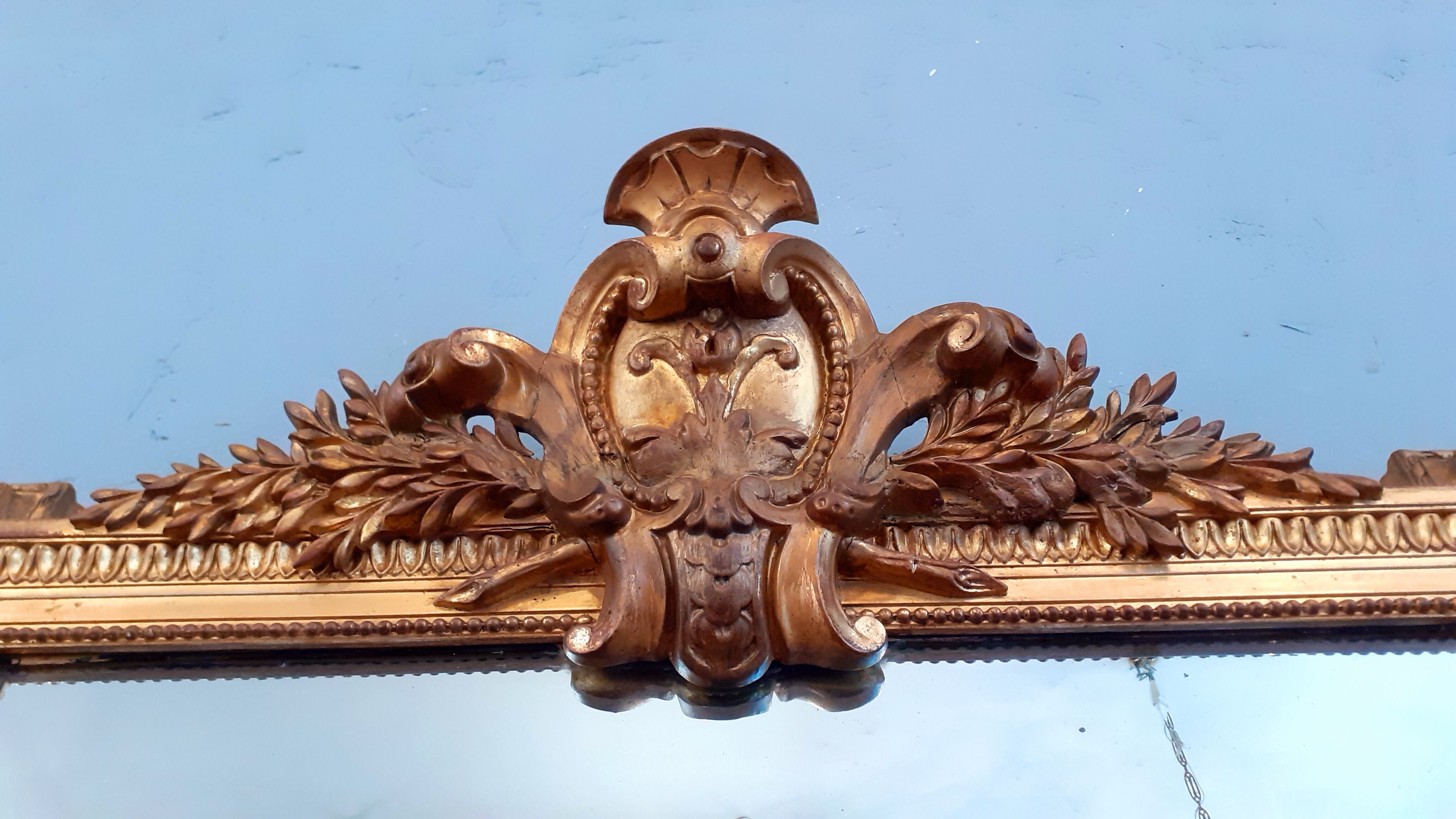 Large mirror XIX th in wood and gilded stucco Louis XVI style