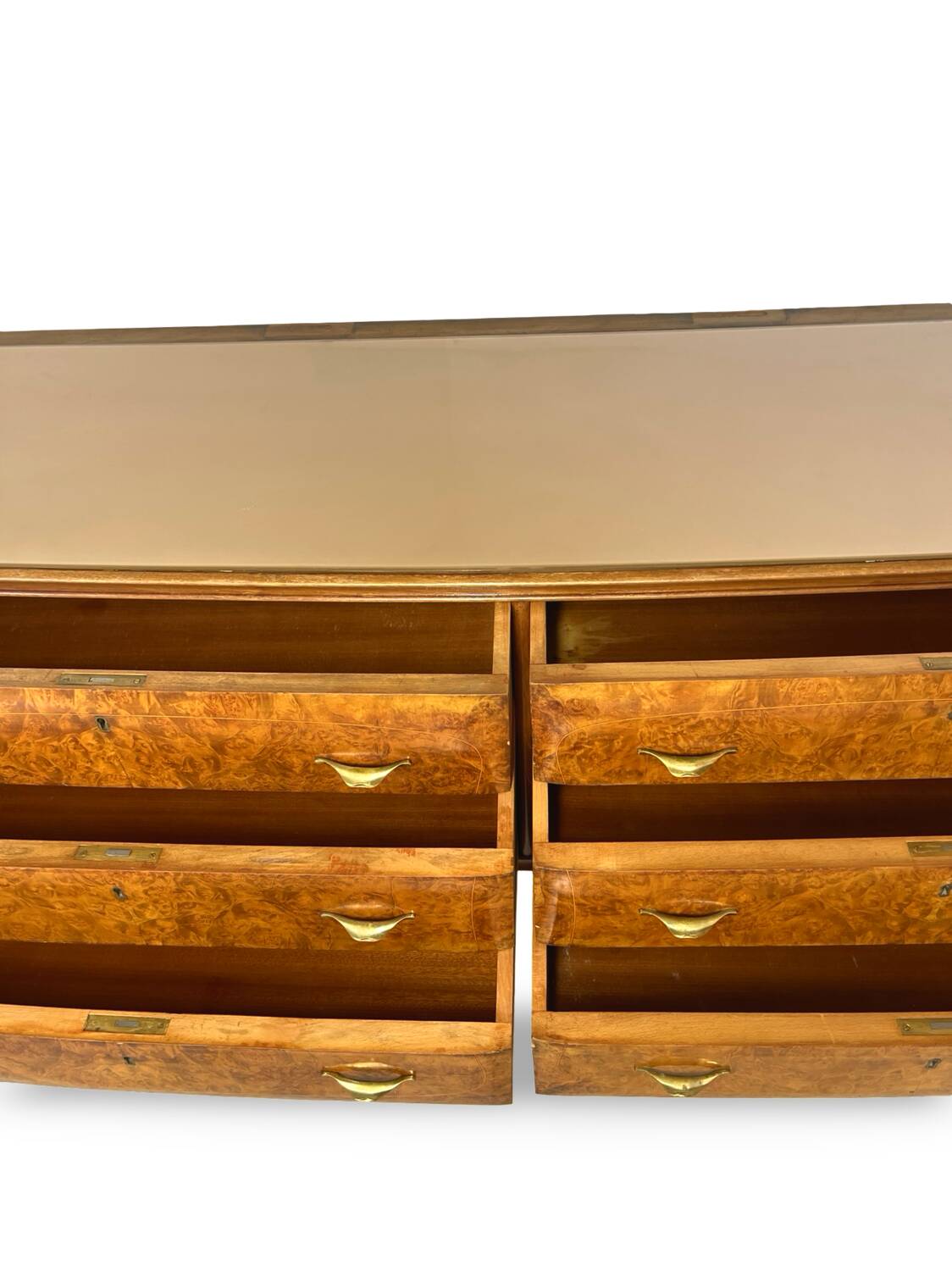 Veneered burl walnut chest of drawers with light warm brown glass top
