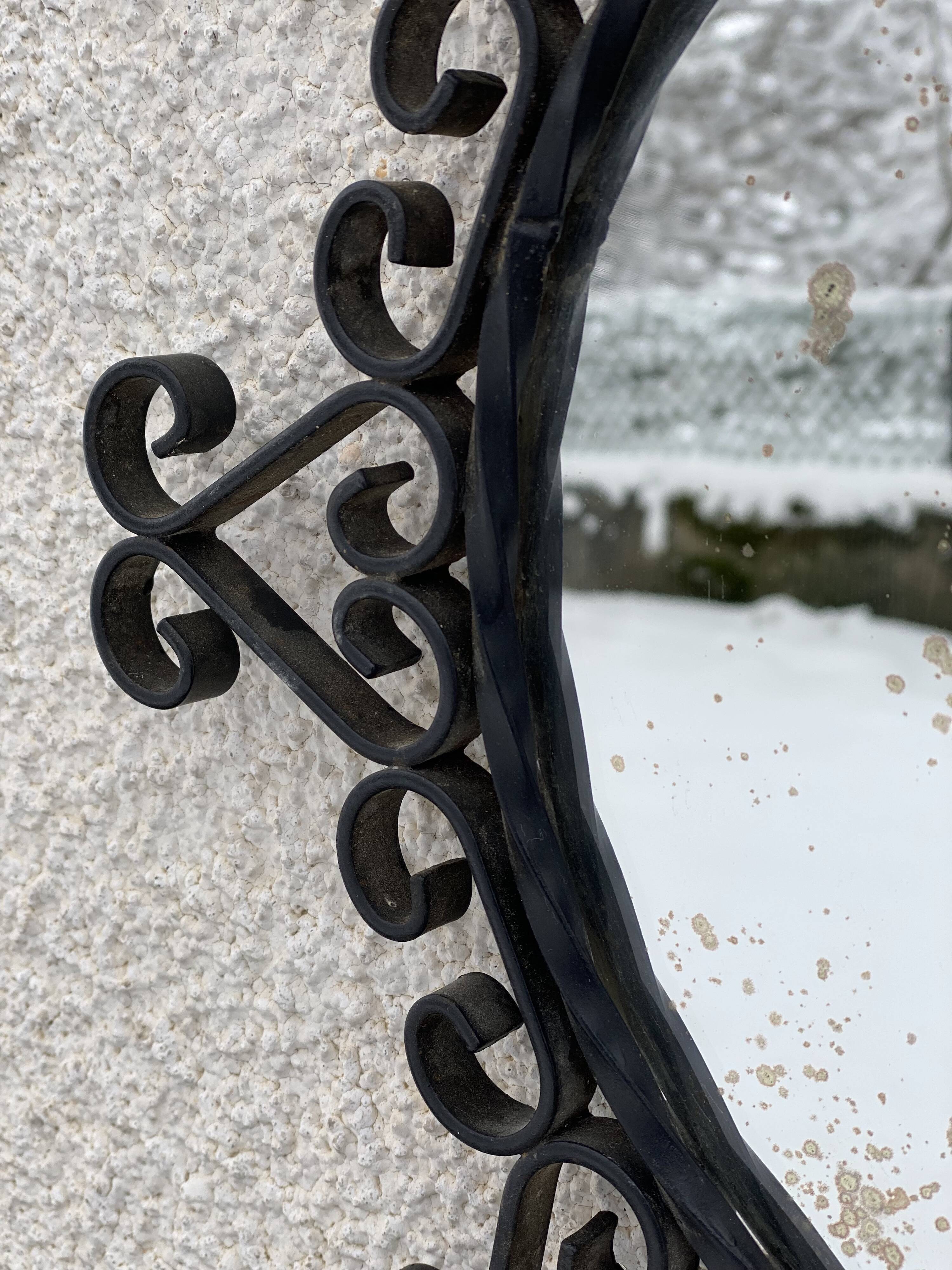 Vintage 1950s round metal mirror in the style of Chaty