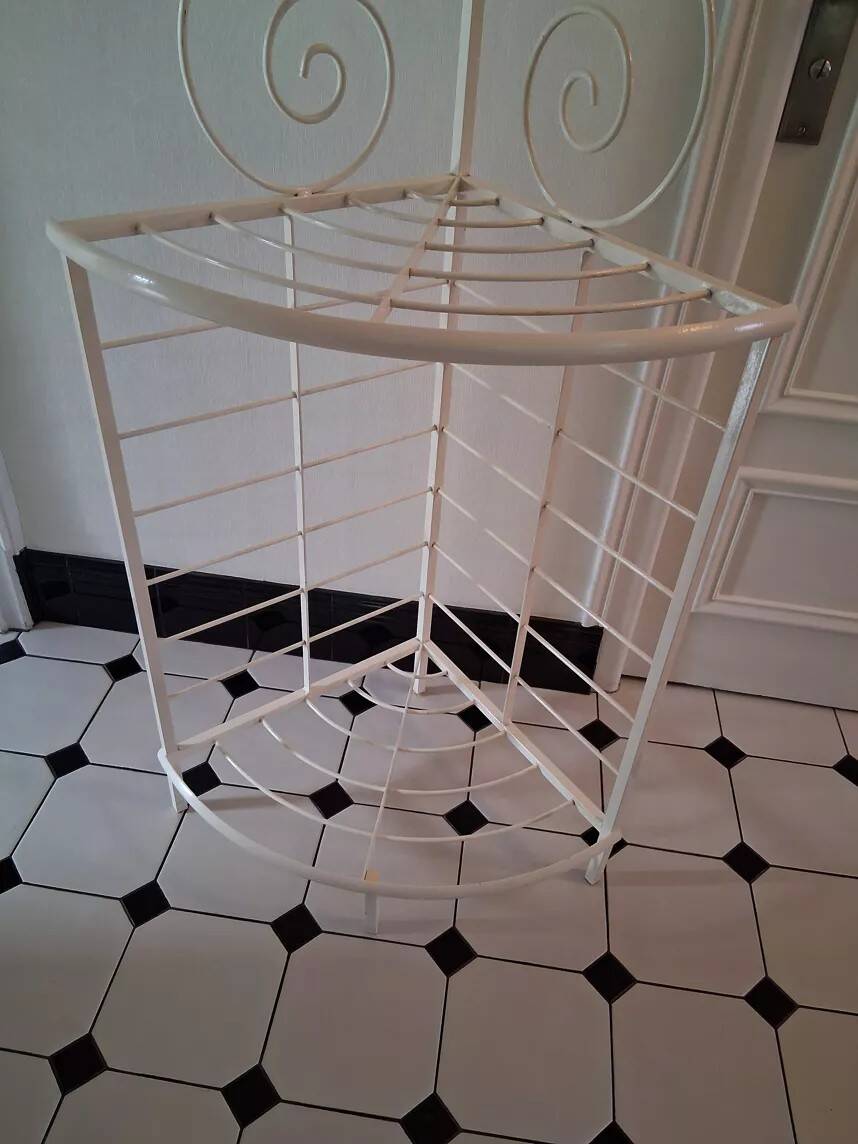 Cream and brass corner bakery shelf in wrought iron