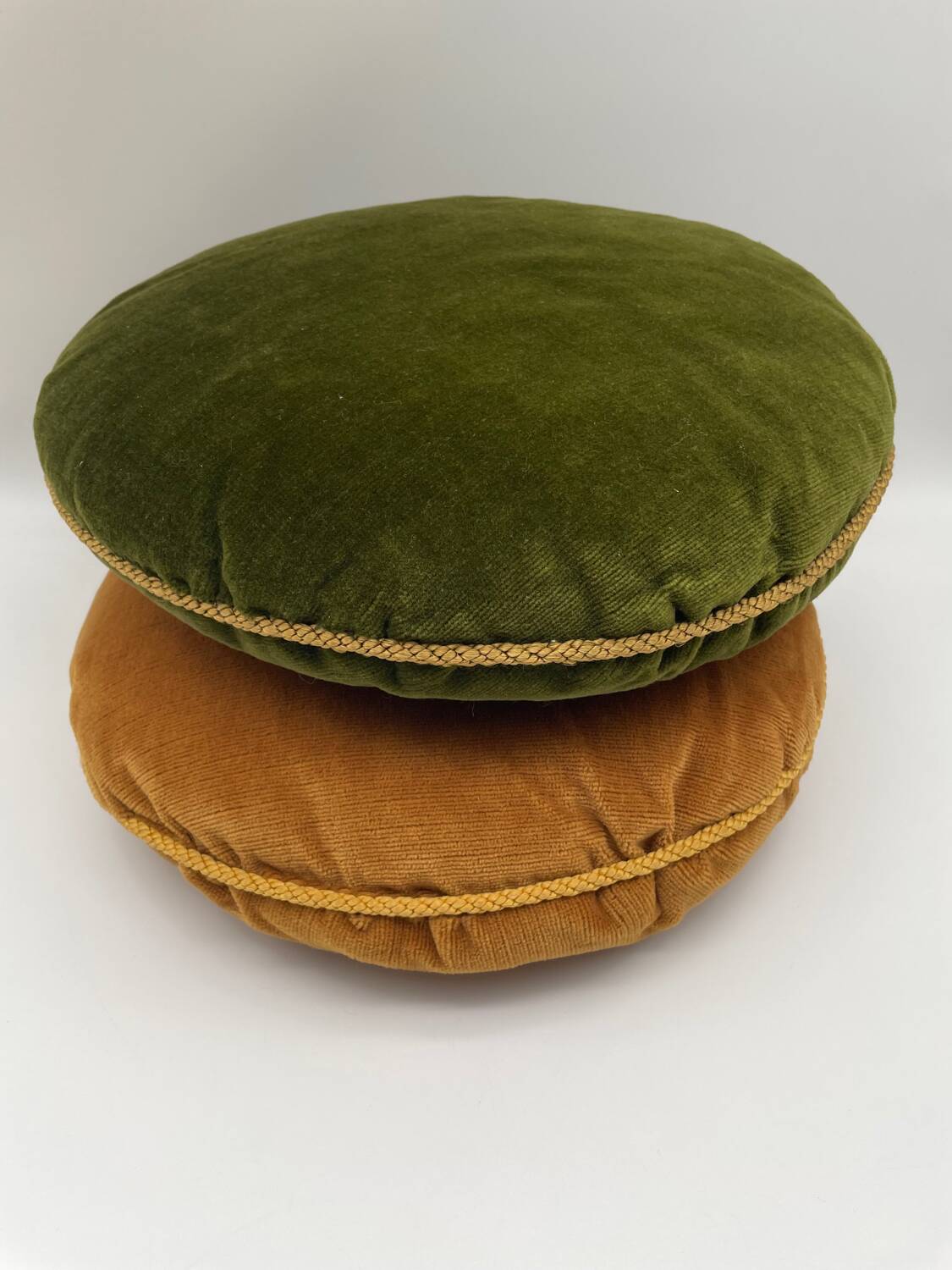 Pair of vintage round velvet cushions