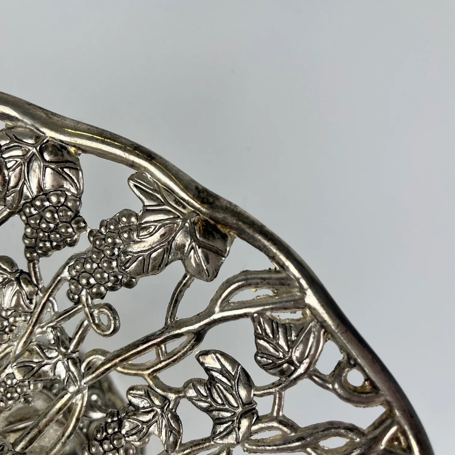 Openwork metal bowl with vine leaf and grape motif, 20th century