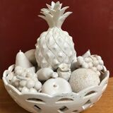 Trompe l'oeil fruit cut in white earthenware by Jean Roger, circa 1960.