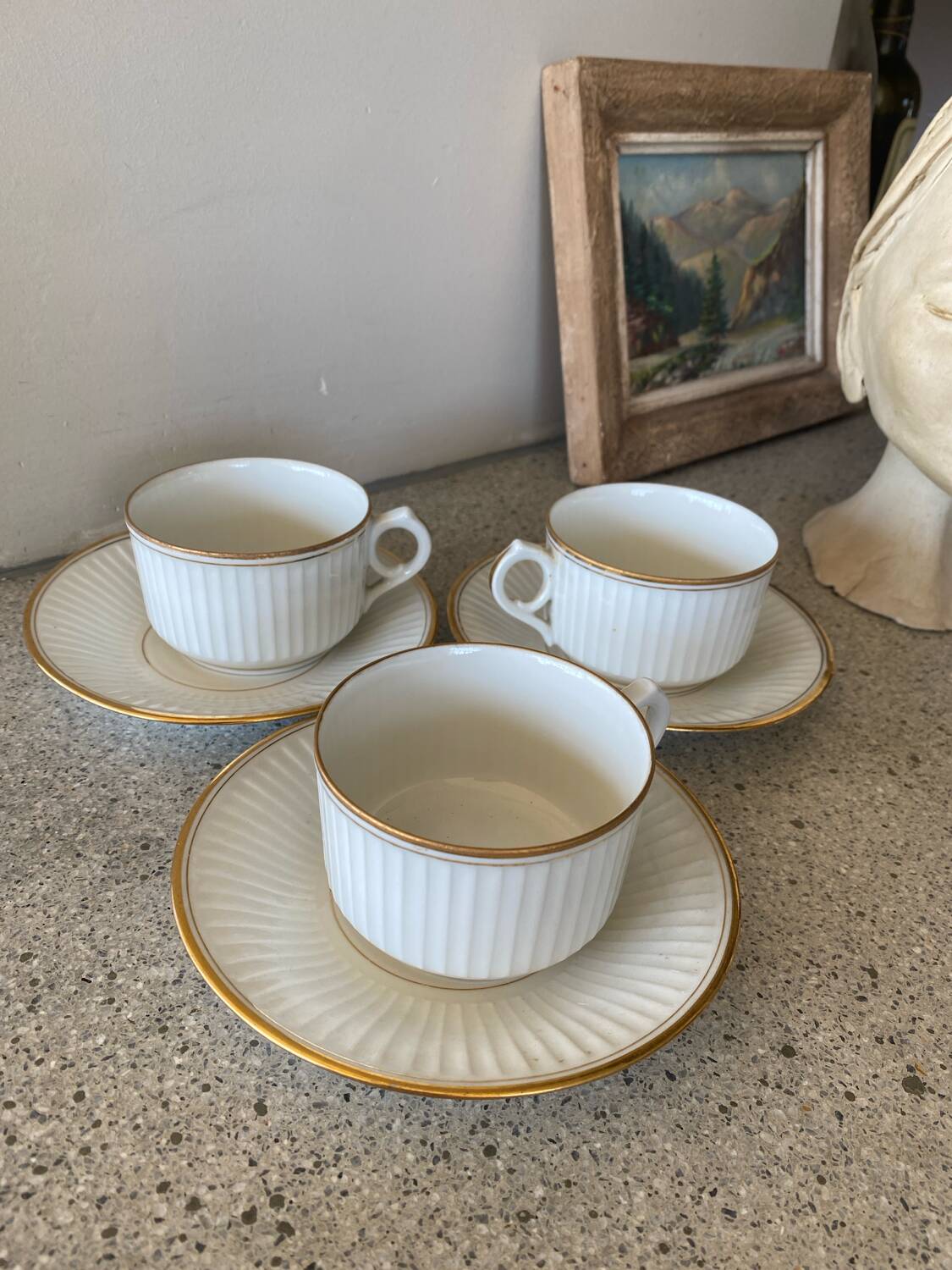 3 white and gold tea or chocolate cups