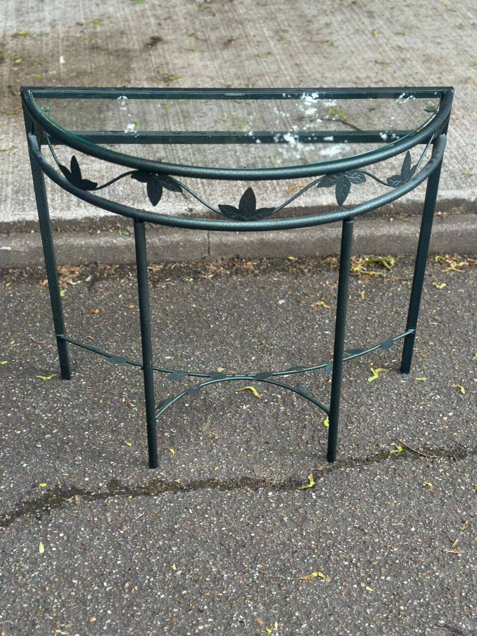 Grey-green wrought iron half-moon console with glass, 85cm.