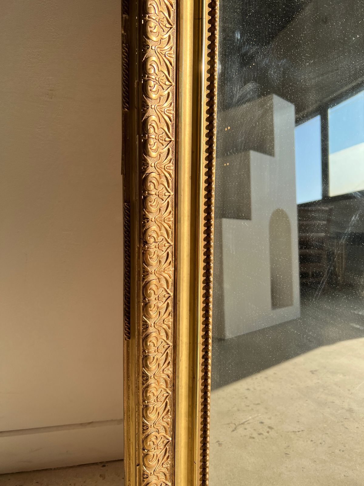 Gilded mirror with frieze h2m10 l:73cm
