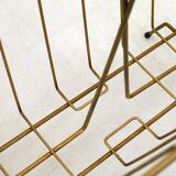 Mid-century openwork magazine rack, in gold metal & wooden handle.