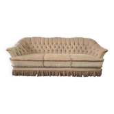 Canapé vintage beige avec franges