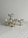 6 dessert bowls on a shiny metal stand.