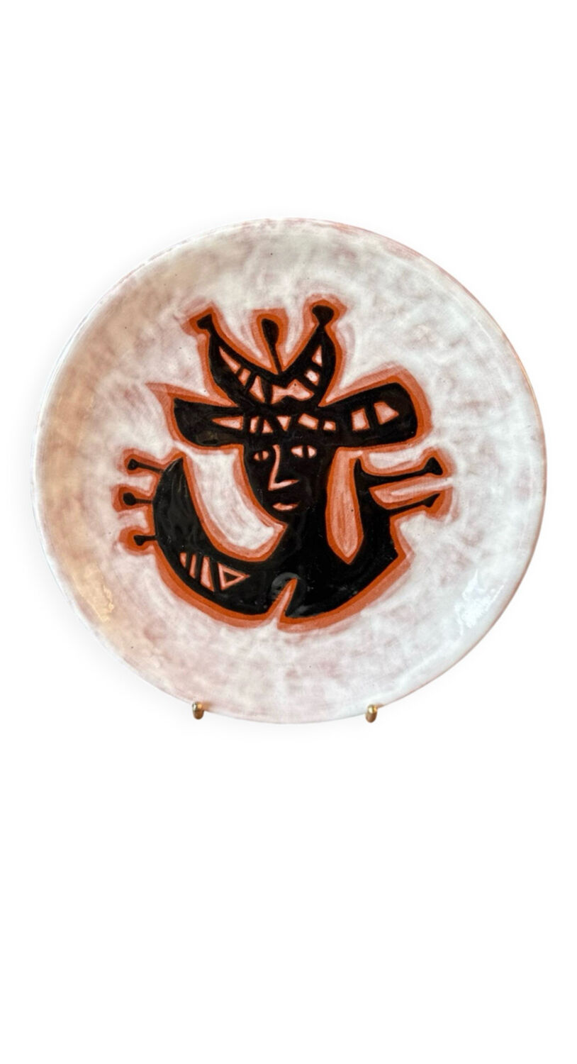 Terracotta plate, Jean Lurçat decorated with a character on a white background.